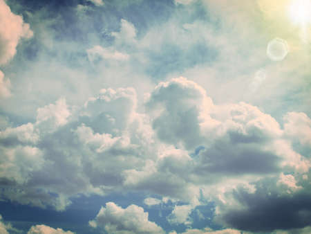 sun shining on stormy clouds from the top, tonedの写真素材