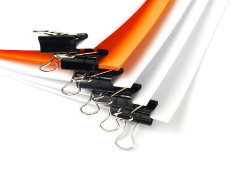 several stacks of paper held by binder clips, shallow depth of fieldの写真素材
