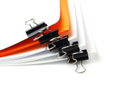 several stacks of paper held by binder clips, shallow depth of fieldの写真素材
