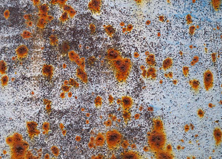 Iron sheet surface with rust stains and old painting on itの写真素材