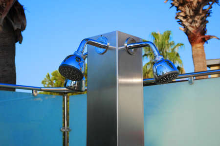 Closeup of outdoor shower heads. Outdoor poolside shower column.の写真素材