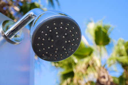 Closeup of outdoor shower head. Outdoor pool shower. Bootom view of shower sprinkler.の写真素材