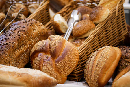 Various bread on shelf and in basket, Homemade bread. Fresh baked bread in baker shop.