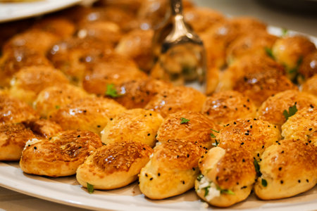 Closeup of fresh baked buns on tray. Stuffed buns served for breakfast on buffet line.の写真素材
