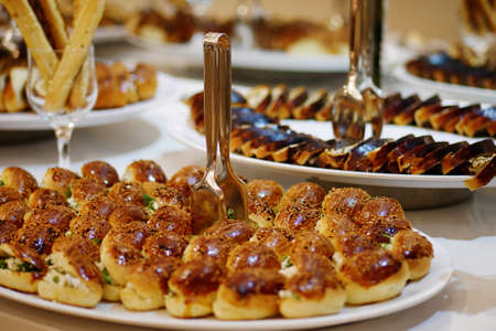 Fresh baked stuffed buns on tray. Stuffed buns served for breakfastoin on buffet lineの写真素材
