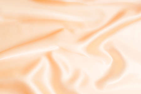 gold wavy silky satin backgroundの写真素材