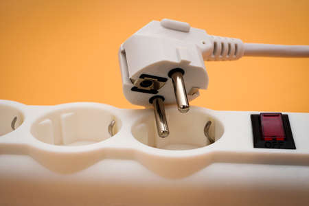 Closeup of unplugged electrical plug on power stripの写真素材