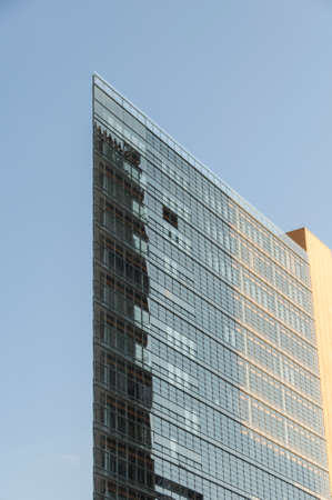 Sky reflected in the windows of a modern office buildingのeditorial素材
