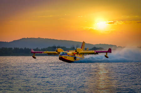 SIBENIK, CROATIA, August 6 2012 - Bombardier 415 Superscooper (Canadair cl-415) scooping water in...