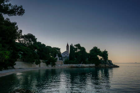 Dawn over a monastery located on the beaches of Bol, island of Brac, Croatia