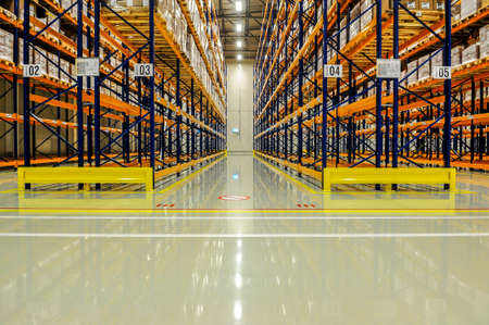 View through the racks of a large warehouseのeditorial素材