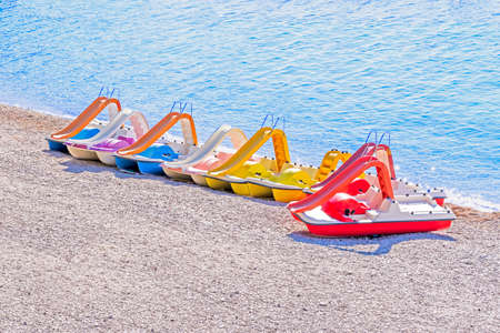 Pedal boats on beachの写真素材