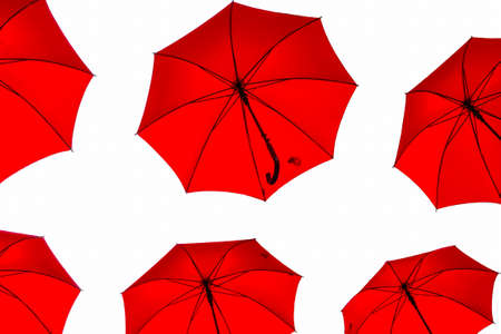 Red umbrellas on white background, shot from below, isolated graphic designの写真素材