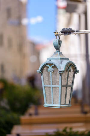 Vintage, old street lamp in classic style, made of cast iron and or metalの写真素材
