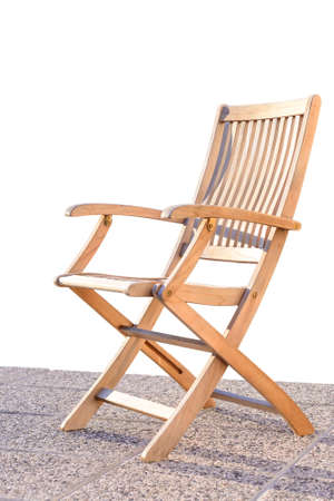 Foldable deck chair on outdoor terrace, made of teak tropical hardwoodの写真素材