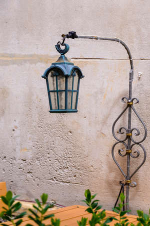 Vintage, old street lamp in classic style, made of cast iron and or metalの写真素材