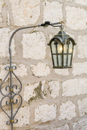 Vintage, old street lamp in classic style, made of cast iron and or metalの写真素材