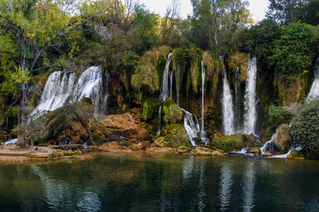 Kravice waterfalls in Bosnia and Herzegovina. A natural marble near Mostar, Bosnia and Herzegovina, at 25m (80ft) height the Trebizat river plunges down the rocks into crystal clear pools.の写真素材