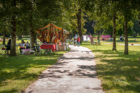 Maribor, Slovenia - June 28 2014: Traditional Art camp in city park "Mestni park" as part of traditional Lent festival attracts young and old for cultural and leisure activities.のeditorial素材