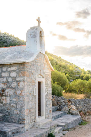 Small stone chappel in the Mediterranean, island of Brac, Croatia / morning daylightの写真素材