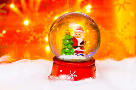 Santa in snowdome, Happy New Year 2017, Christmas, bright defocused lights in backgroundの写真素材