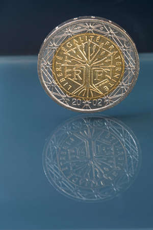 National side of two euro coin issued by France and depicts a tree symbolizing life, continuity and growth with inscription liberty, equality, fraternityの写真素材