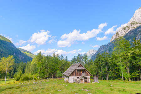 Mountain cabin, hut in European Alps, located in Robanov kot, Slovenia, popular hiking and climbing place with picturescue viewの写真素材