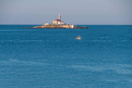 Lighthouse on a small island Sveti Ivan near Rovinj, Croatiaの写真素材