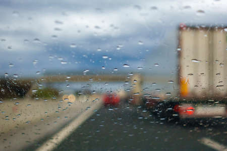 Driving in the Rain, drivers view from car, out of focus, highwayの写真素材
