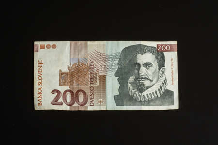 Obsolete 200 tolar bill of Slovenia, became obsolete with introduction of Euro currency, isolated on...