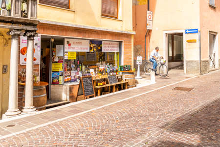 Cividale del Friuli, Italy - Aug 14 2018: Tourist street deli shop with traditional Italian products in Cividale del Friuli, Italy offering wine, sweets and meat products to touristsのeditorial素材