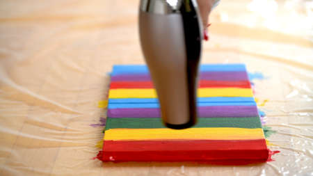Painting rainbow on canvas, gay pride, transsexuality concept, sexual diversityの写真素材
