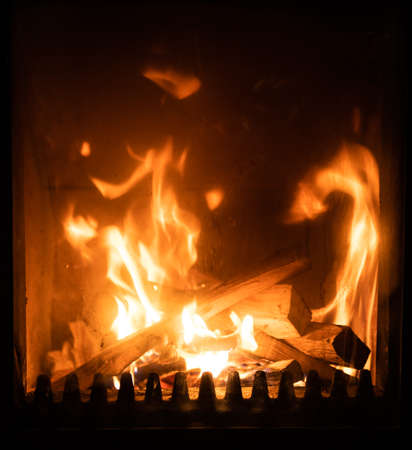Fire in stove, close up, firewood burning, detail interior scene, winter conceptの写真素材
