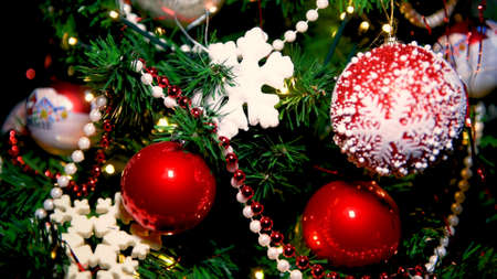 Christmas tree decoration close up, Xmas holyday concept, colorful traditional ornamentsの写真素材