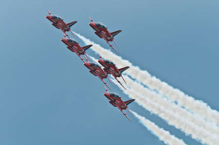 Maribor, Slovenia - June 3 2011: Red Arrows Aerobatic Display Team performing at public airshow in Maribor. The Red Arrows are the official display team of Royal Air Force. Free admittance to show.のeditorial素材