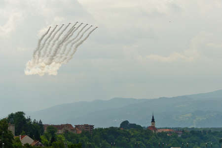 Maribor, Slovenia - June 3 2011: Red Arrows Aerobatic Display Team performing at public airshow in Maribor. The Red Arrows are the official display team of Royal Air Force. Free admittance to show.のeditorial素材