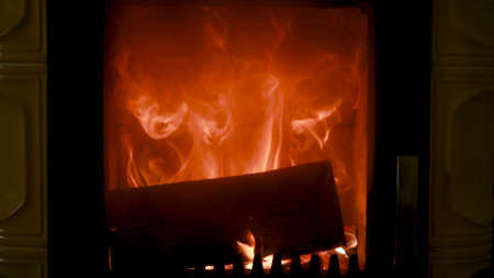 Fire in stove, close up, firewood burning, detail interior scene, winter conceptの写真素材