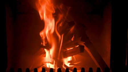 Fire in stove, close up, firewood burning, detail interior scene, winter conceptの写真素材