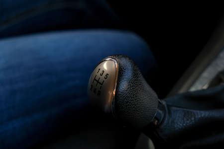 Closeup of manual gear shifter on manual transmission, 5 speed gear drive