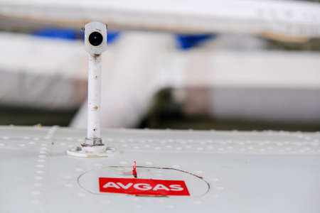 Pitot probe on top of light aircraft wing, close up detail with fuel tank latchの写真素材
