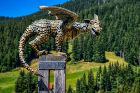 Solcava, August 17 2019: Bronze statue of the Lintver dragon, a signpost on the Solcava Panoramic road above Logar valley in Sloveniaのeditorial素材