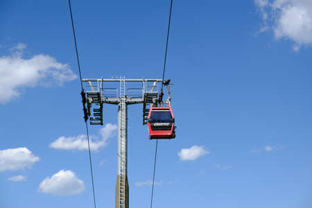 Maribor, Slovenia - May 2 2019: Red cabins of the Pohorska vzpenjaca cable car in Maribor, Slovenia connect the top of Pohorje mountain with the cityのeditorial素材