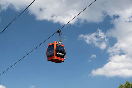 Maribor, Slovenia - May 2 2019: Red cabins of the Pohorska vzpenjaca cable car in Maribor, Slovenia connect the top of Pohorje mountain with the cityのeditorial素材