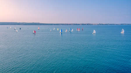 Portoroz, Slovenia - Oct 12 2019: Sailing boats sail from Portoroz towards gulf of Trieste, Italy to participate at Barcolana 2019 regattaのeditorial素材