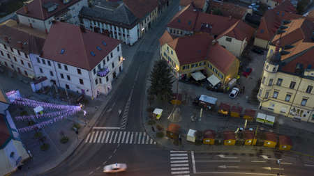 Slovenska Bistrica, Slovenia - Dec 25 2019: Christmas lights switch on in main square of small town Slovenska Bistrica, Slovenia, aerial time-lapse of Xmas market with decorationのeditorial素材