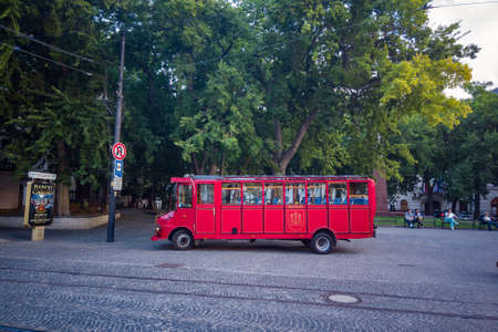 An antique red bus on the streets of Bratislavaのeditorial素材