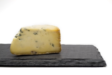blue cheese on slate boardの写真素材