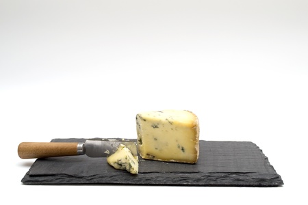 Blue cheese on slate boardの写真素材