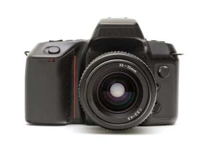 Black digital SLR camera on a white background