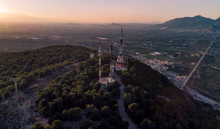 landscape of a sunset in the mountains from a droneの写真素材